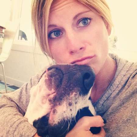 Ashton shares a photo with her dog